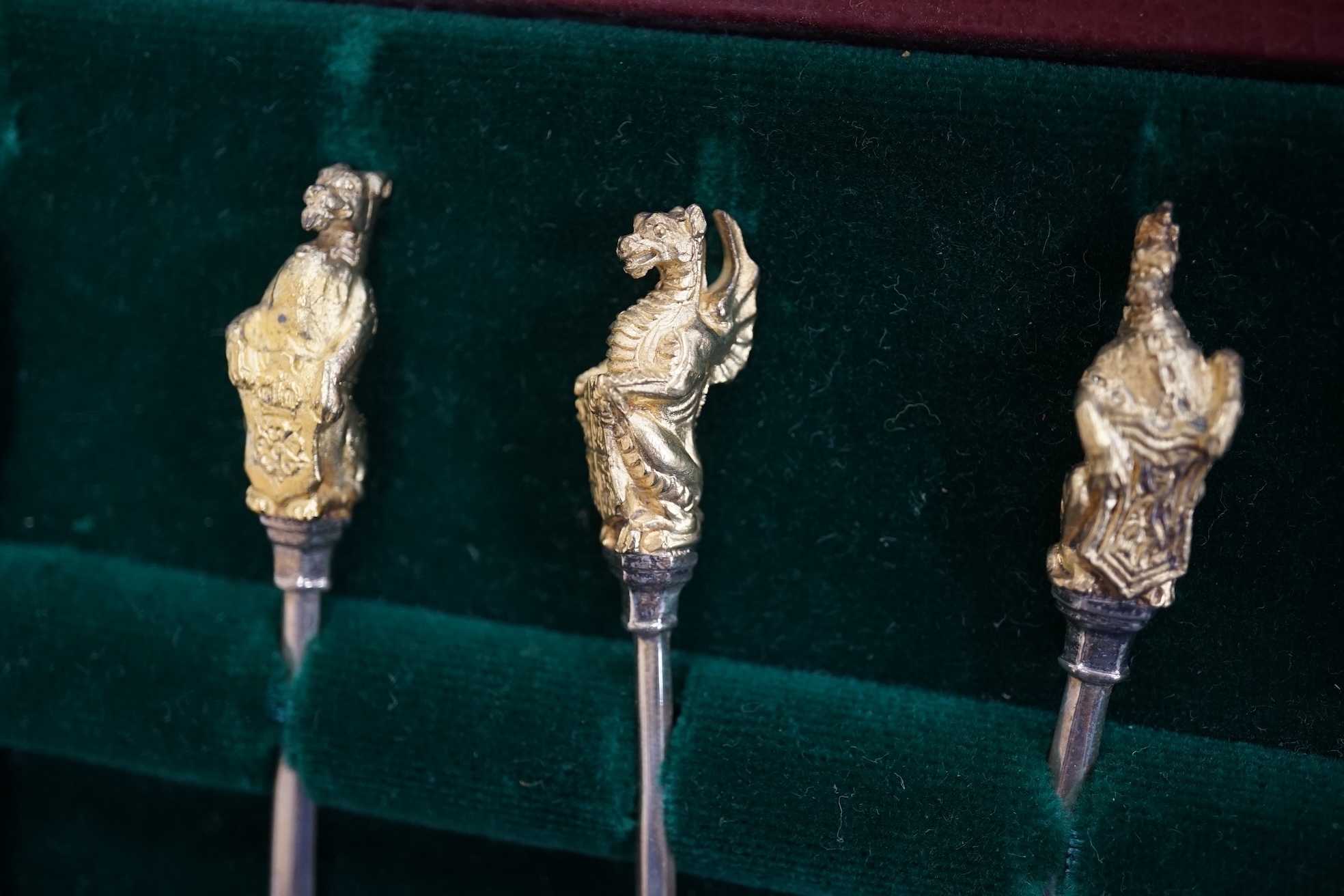 A cased set of ten parcel gilt silver 'The Queens Beasts' Elizabeth II Silver Wedding Anniversary commemorative spoons, William Comyns & Sons Ltd, London, 1972, 11.6cm. Condition - fair to good